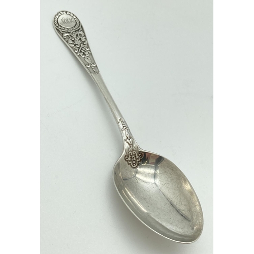 1072 - A decorative Victorian Richard Martin & Ebenezer Hall silver spoon. With ornate detail to handle and... 