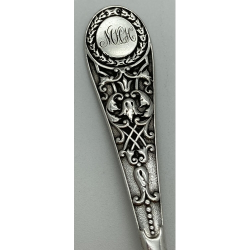 1072 - A decorative Victorian Richard Martin & Ebenezer Hall silver spoon. With ornate detail to handle and... 