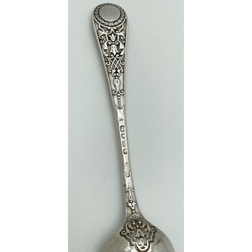 1072 - A decorative Victorian Richard Martin & Ebenezer Hall silver spoon. With ornate detail to handle and... 