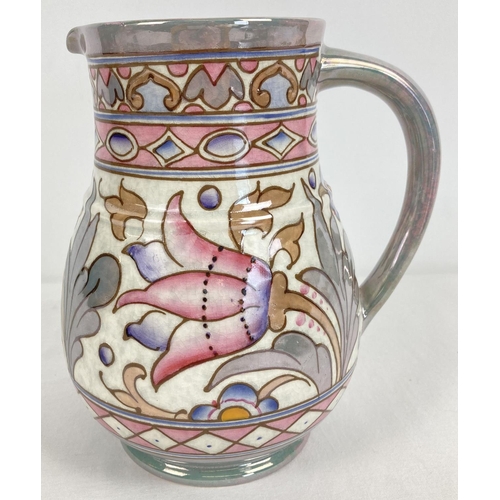 1155 - A 1920's Charlotte Rhead, Bursley Ware jug by H.J. Woods. In wind tossed tulip deisgn. Green, pink a... 