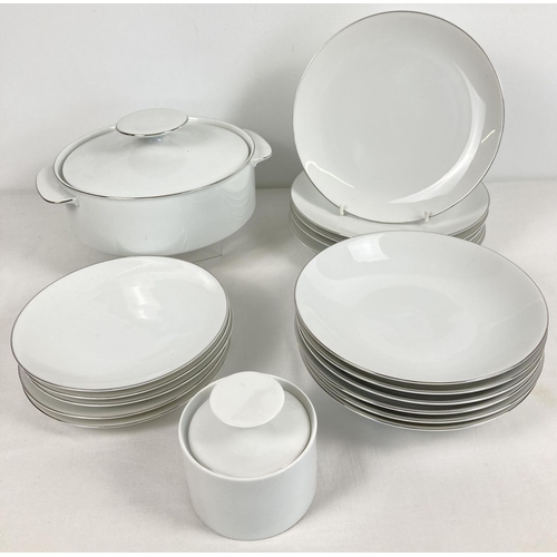 1156 - A collection of dinner ware by Thomas, Germany. Plain white with silver rim detail. Comprising: Lidd... 