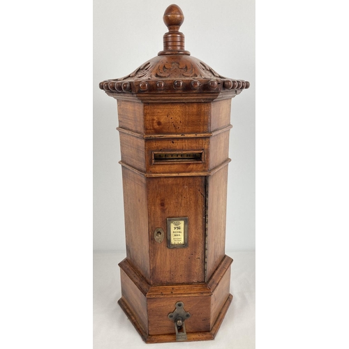 1319 - A wooden model of a replica Victorian hexagonal  post box. With carved detail to top and turned fini... 