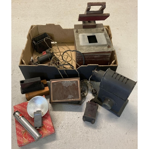 1322 - A box of early camera and film equipment. To include an early magic lantern/projector, red developin... 