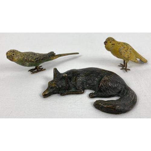 1323 - 2 hand painted lead bird figures, a Budgerigar and a Canary, together with a brass sleeping fox figu... 