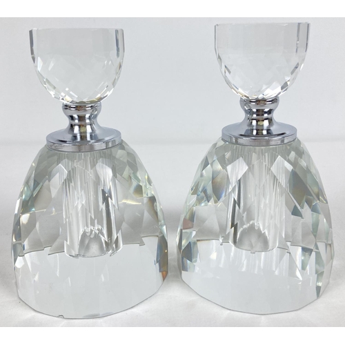 1187 - A pair of large circular shaped faceted clear glass perfume bottles. With screw lids and clear glass... 