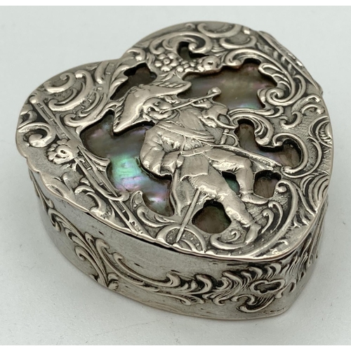 1080 - A continental 800 silver heart shaped pill/trinket box with classic figure and scroll decoration to ... 