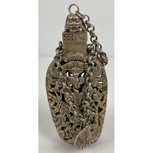 1200 - A Chinese white metal incense bottle with decorative pierced work panel front & back. Chained bottle... 