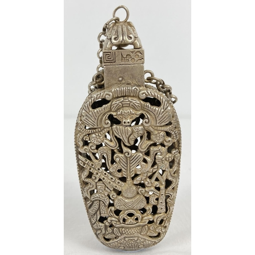 1200 - A Chinese white metal incense bottle with decorative pierced work panel front & back. Chained bottle... 