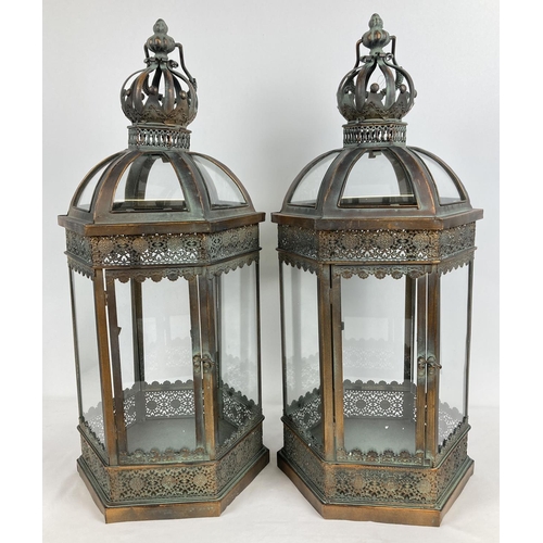 1328 - A large pair of bronzed effect hexagonal lanterns with clear glass panels. One panel hinged and with... 