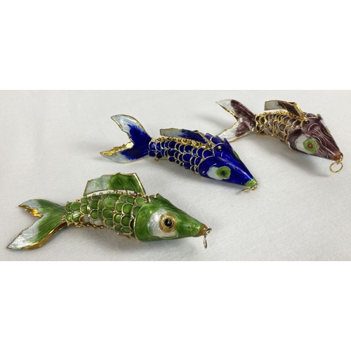 1330 - 3 enamelled metal articulated fish pendants. In navy blue, pale green and mauve, with fully jointed ... 