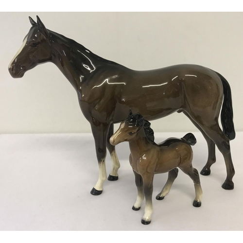 1162 - 2 Beswick horse figurines. A Bois Roussell Racehorse together with a foal (a/f). Both in brown colou... 