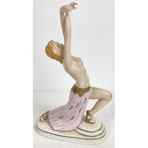 1166 - An Austrian Wien porcelain semi nude figurine of a dancer in an Art Deco style. With gilt detailing.... 