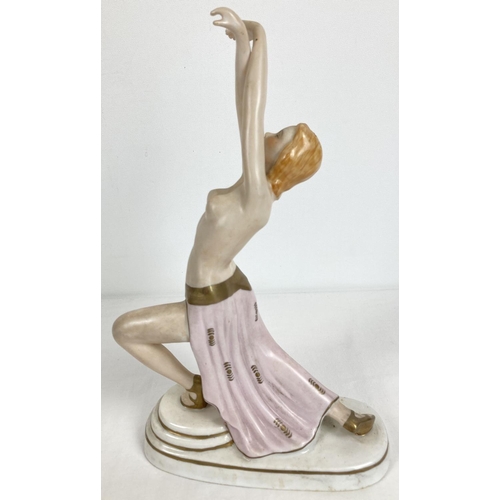 1166 - An Austrian Wien porcelain semi nude figurine of a dancer in an Art Deco style. With gilt detailing.... 