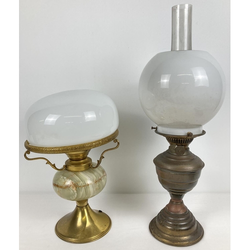 1371 - A vintage brass oil lamp with glass chimney and shade, together with a brass and green onyx desk lam... 