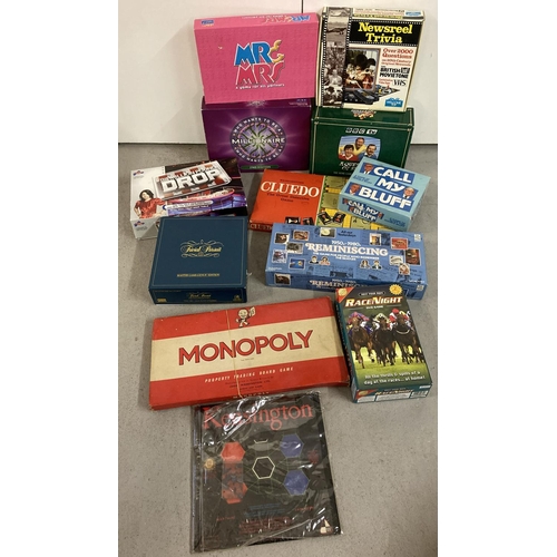 1255 - A collection of vintage board games to include TV related board games. Lot includes: Trivial Pursuit... 