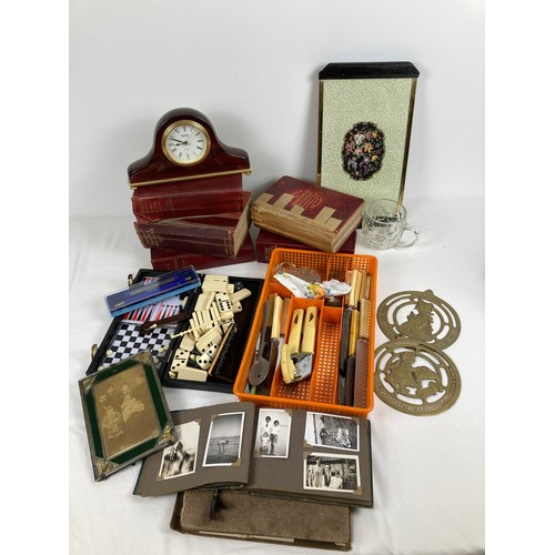 1306 - A box of assorted vintage items to include books, cutlery and ephemera. Lot includes: Regent of Lond... 