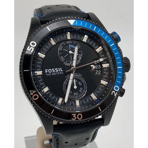 1173 - A men's chronograph 741407 wristwatch by Fossil with black leather strap. Black face with luminous h... 