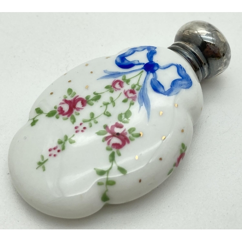 1191 - 2 early 20th century ceramic scent bottles with hallmarked silver screw top lids. Shaped bottles fea... 