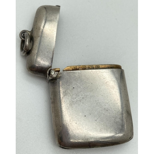 1192 - An Edwardian silver curve backed vesta case hallmarked for G. Loveridge, B'ham 1902. With hanging ba... 