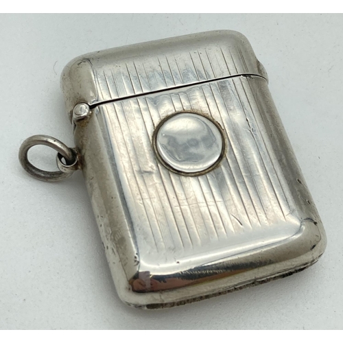 1194 - A Sampson Mordan & Co Edwardian silver 'Seamless' vesta case. With engine turned chanelled detail fr... 