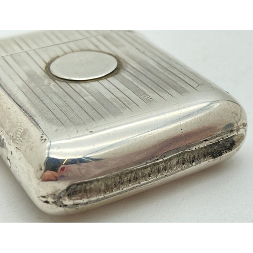 1194 - A Sampson Mordan & Co Edwardian silver 'Seamless' vesta case. With engine turned chanelled detail fr... 