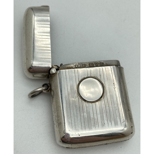 1194 - A Sampson Mordan & Co Edwardian silver 'Seamless' vesta case. With engine turned chanelled detail fr... 