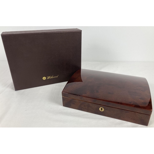 1066 - A new and boxed red Birdseye maple jewellery box by Walwood. Cream velveteen lining with ring/earrin... 