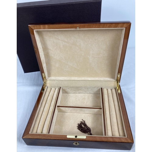 1067 - A new and boxed red Birdseye maple jewellery box by Walwood. Cream velveteen lining with ring/earrin... 