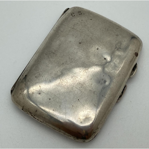 1197 - A small curve backed silver cigarette case with engraved monogram to top corner. Hallmarked for Birm... 