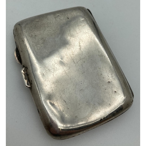 1197 - A small curve backed silver cigarette case with engraved monogram to top corner. Hallmarked for Birm... 