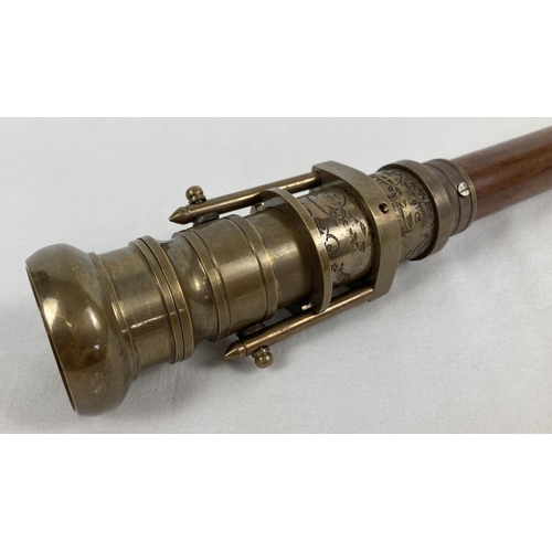 1363 - A reproduction wood and brass walking stick with swivel top telescope/compass handle. Approx. 95.5cm... 