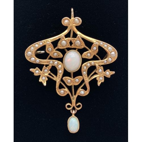 1104 - An Art Nouveau 9ct gold pendant brooch set with oval opal cabochons and seed pearls. Marked 9ct to r...