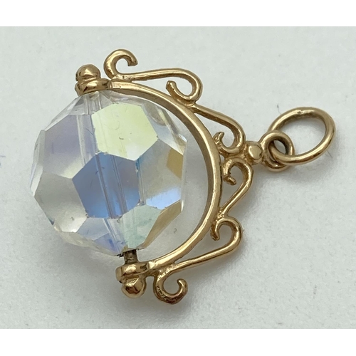 1111 - A 9ct gold pendant with faceted crystal swivel fob. Tests as 9ct gold. Crystal approx. 1.25cm diamet... 