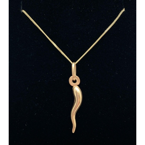 1113 - A 9ct gold Horn of Plenty pendant on a 16