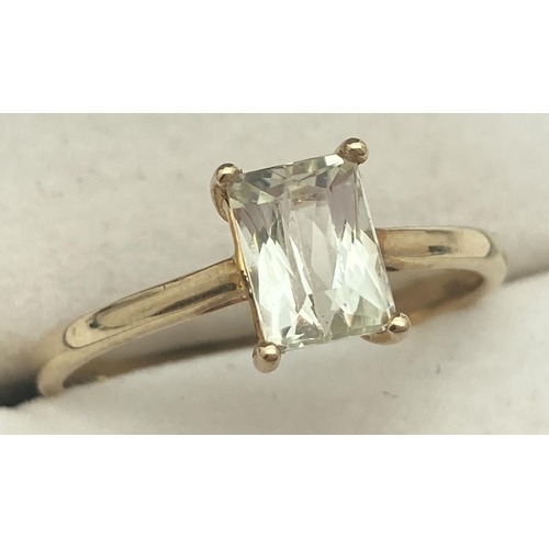 1120 - A 10k yellow gold dress ring set with an prong set emerald cut Serenite gemstone. Ring size Q. Fully... 