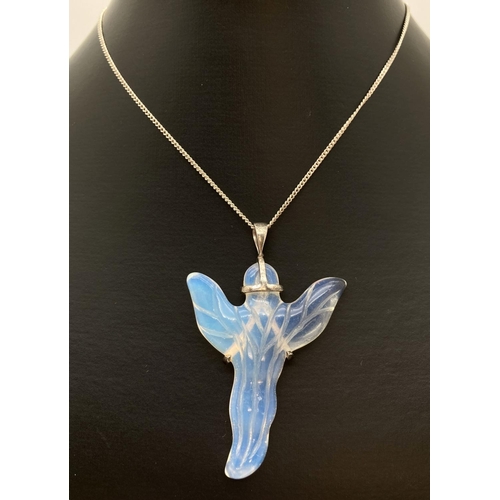 1131 - A large Opaline angel shaped pendant with silver mount & bale. On a 19