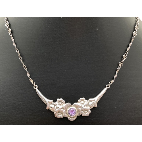 1137 - A 925 silver Art Nouveau style fixed pendant necklace set with amethyst stone. Floral design pendant... 