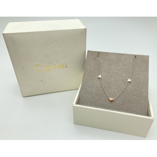 1141 - A boxed Clogau Welsh Silver bracelet with 3 small heart shaped links. Marked 925 to lobster claw cla... 