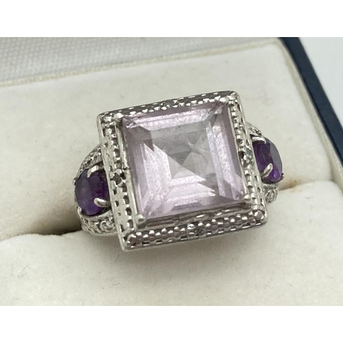 1147 - A chunky 925 silver dress ring set with central square cut Rose De France. With pierced work mount a... 