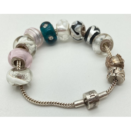 1162 - A Rhona Sutton snake chain bead bracelet with 9 glass beads & 2 others. Silver mounted glass beads a... 