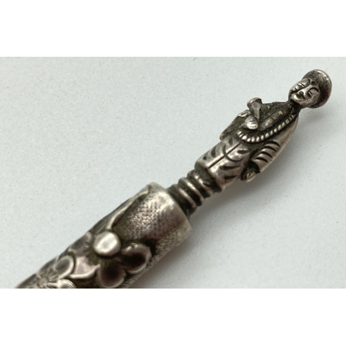 1204 - A large Chinese export silver pickle fork with Cherry Blossom decoration and figural finial. Hallmar... 