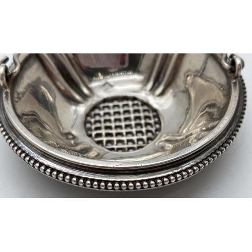 1207 - A 19th century French silver strainer with swing handle and beaded rim. Hallmarked to inner bowl. Ap... 