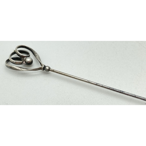 1214 - A Charles Horner Edwardian silver hat pin of looped and ball design. Hallmarked for Chester 1908. Ap... 