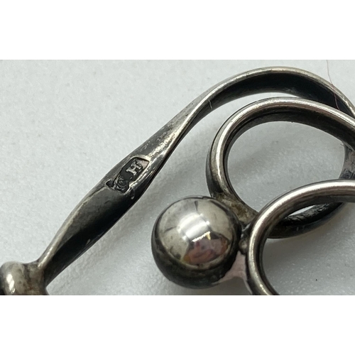 1214 - A Charles Horner Edwardian silver hat pin of looped and ball design. Hallmarked for Chester 1908. Ap... 