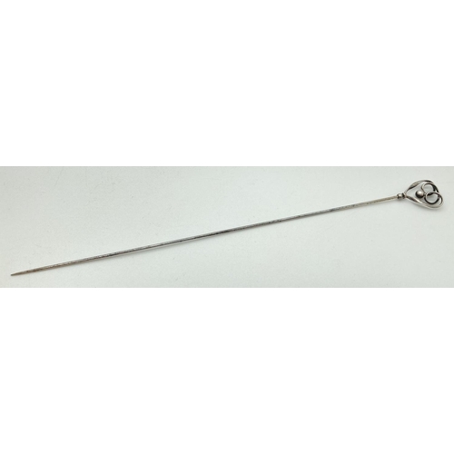 1214 - A Charles Horner Edwardian silver hat pin of looped and ball design. Hallmarked for Chester 1908. Ap... 