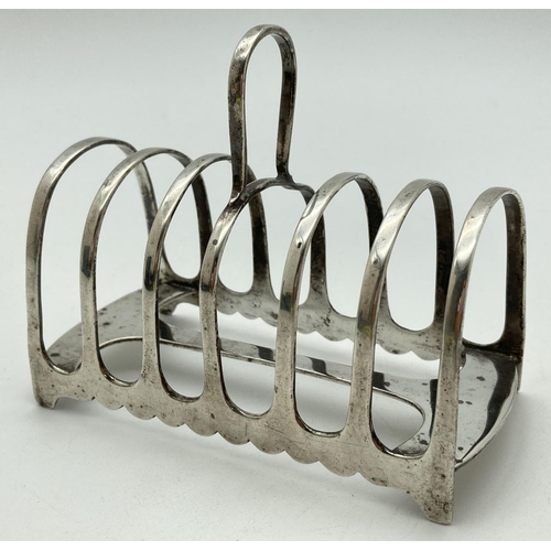 1216 - A James Dixon & Sons, Art Deco silver 6 slice toast rack with looped handle. Hallmarked to underside... 