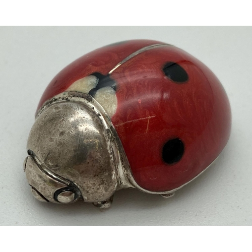 1218 - A small 925 silver ladybird with enamelled body in red, black & cream. Stamped to underside. Approx.... 