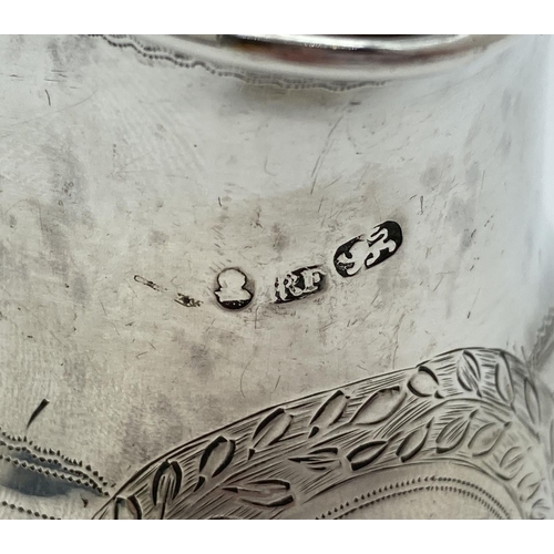 1219 - A Georgian silver cream jug with engraved floral banded design. Featuring a wreathed circular shaped... 