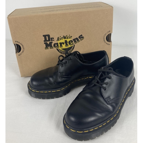 19 - A pair of boxed Dr Martens smooth black leather shoes, 1461, with yellow stitching. Size 4, not orig... 