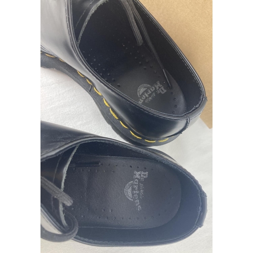 19 - A pair of boxed Dr Martens smooth black leather shoes, 1461, with yellow stitching. Size 4, not orig... 